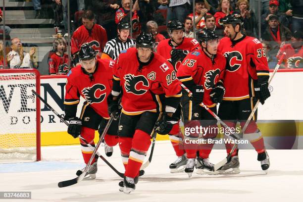 Robyn Regehr and teammates of the Calgary Flames celebrate a goal against the Colorado Avalanche on November 18, 2008 at Pengrowth Saddledome in...