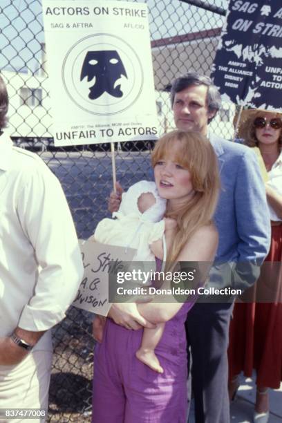 Actress Susan Richardson and her baby daughter Sarah Virden attends SAG and AFTRA Actors On Strike in circa 1980 in Los Angeles, California.