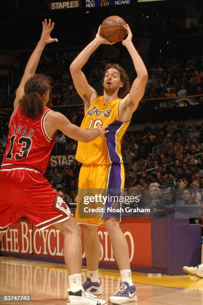 Pau Gasol of the Los Angeles Lakers looks to pass against Joakim Noah of the Chicago Bulls at Staples Center on November 18, 2008 in Los Angeles,...