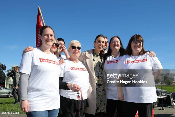 Labour leader Jacinda Ardern and MP for Palmerston North, Iain Lees-Galloway, pose for a photo with suppoeters during a housing announcement at...