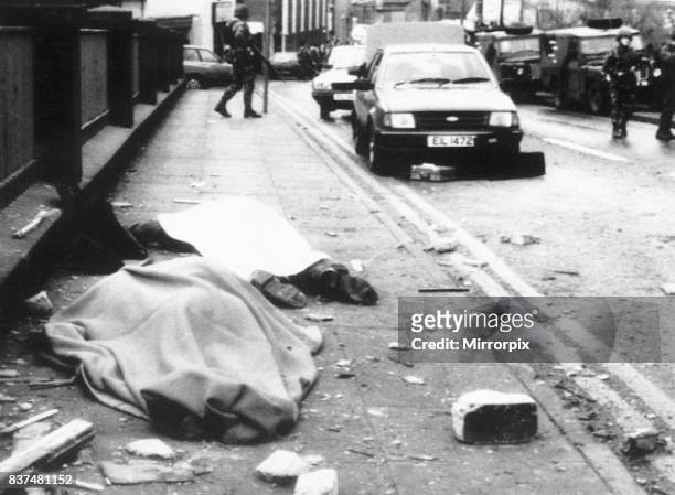 Bodies covered at the roadside Enniskillen Ireland where a 200 pound bomb exploded in a derelict schoolhouse ten minutes before the Rememberence Day...