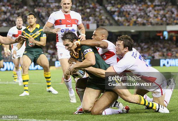 Australian player Billy Slater crashes through England defenders to score in their Rugby League World Cup match at the Docklands Stadium in Melbourne...