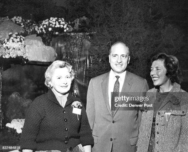 Mrs. David Grimes , chairman of the Denver Symphony Guild's preview party Saturday of the annual Garden Show, chats with Mr. And Mrs. David Dunklee...