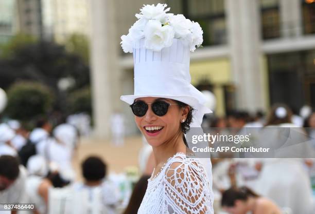 Guests attend the annual New York City Diner en Blanc, August 22 held this year at the plaza at Lincoln Center. The Diner en Blanc, the worlds only...