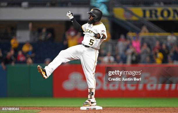 Josh Harrison of the Pittsburgh Pirates reacts after hitting a two run double to right field in the third inning during the game against the Los...