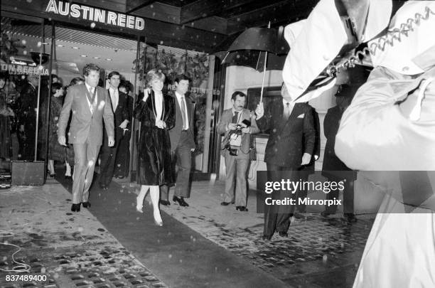 Princess Diana turns on the Christmas lights on Regent Street. Seen here leaving Austin Reed, the entrance to the balcony where she flipped the...