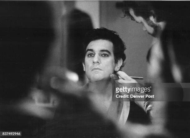 Make-up artist Bruce Geller applies make up to Placido Domingo Sat. Afternoon in his dressing room, before going on stage for a dress rehearsal....