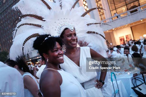 Diners participate in the annual "Diner en Blanc" at Lincoln Center on August 22, 2017 in New York City. Diner en Blanc began in France nearly 30...