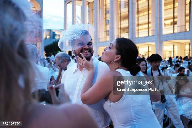 Diners participate in the annual "Diner en Blanc" at Lincoln Center on August 22, 2017 in New York City. Diner en Blanc began in France nearly 30...