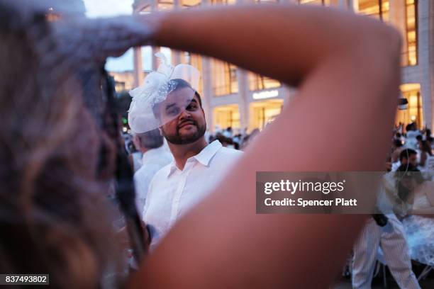 Diners participate in the annual "Diner en Blanc" at Lincoln Center on August 22, 2017 in New York City. Diner en Blanc began in France nearly 30...