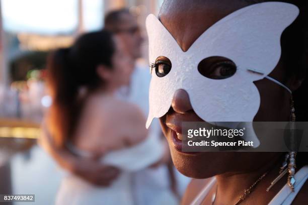 Diners participate in the annual "Diner en Blanc" at Lincoln Center on August 22, 2017 in New York City. Diner en Blanc began in France nearly 30...