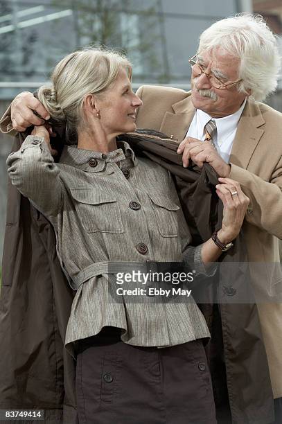 mature couple - overcoat stock pictures, royalty-free photos & images