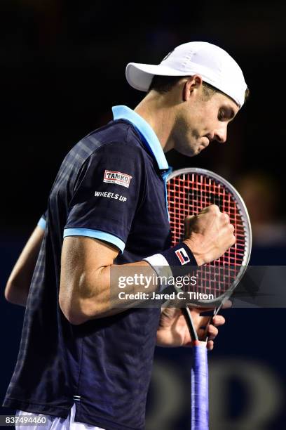 John Isner reacts after a point against Andrey Kuznetsov of Russia during the fourth day of the Winston-Salem Open at Wake Forest University on...