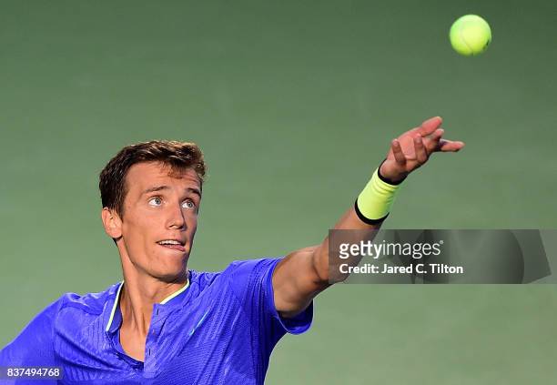Andrey Kuznetsov of Russia serves to John Isner during the fourth day of the Winston-Salem Open at Wake Forest University on August 22, 2017 in...