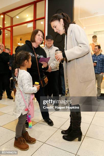 Labour leader Jacinda Ardern meets a young supporter during a visit to The Plaza Shopping Centre on August 23, 2017 in Palmerston North, New Zealand....