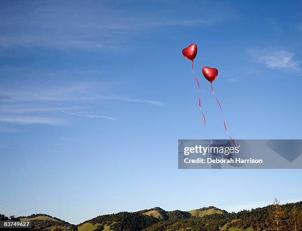 heart balloons - balloons in sky stock pictures, royalty-free photos & images