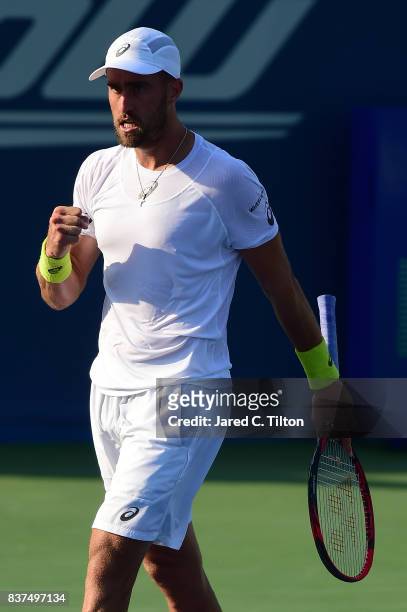 Steve Johnson reacts after winning his match against Yen-Hsun Lu of Chinese Taipei during the fourth day of the Winston-Salem Open at Wake Forest...