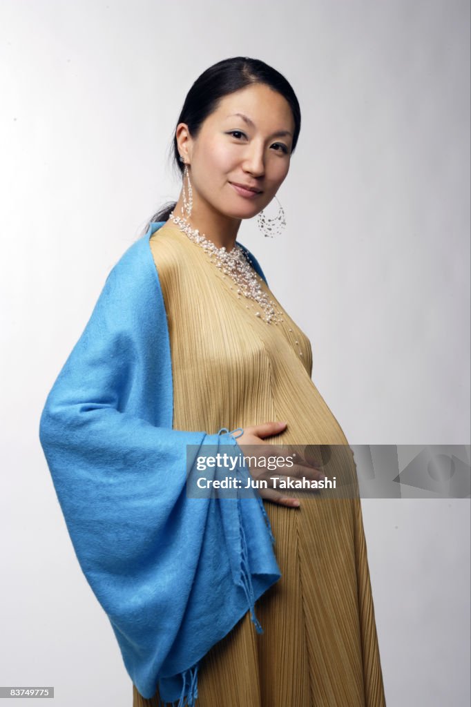 Pregnant Korean Woman Looking At Camera High-Res Stock Photo - Getty Images