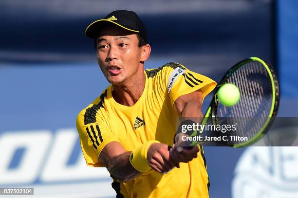 Yen-Hsun Lu of Chinese Taipei returns a shot from Steve Johnson during the fourth day of the Winston-Salem Open at Wake Forest University on August...