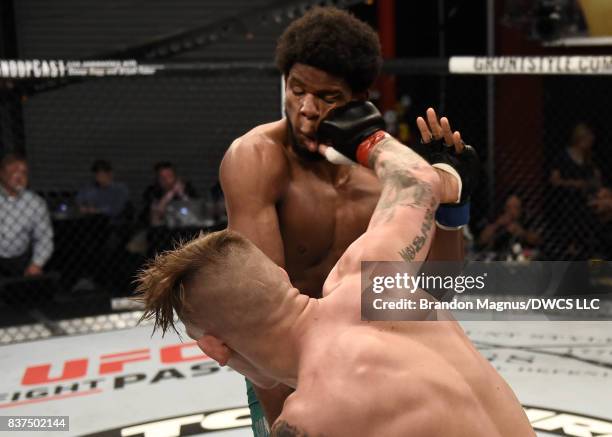 Anton Berzin of Ukraine punches Kennedy Nzechukwu in their light heavyweight bout during Dana White's Tuesday Night Contender Series at the TUF Gym...