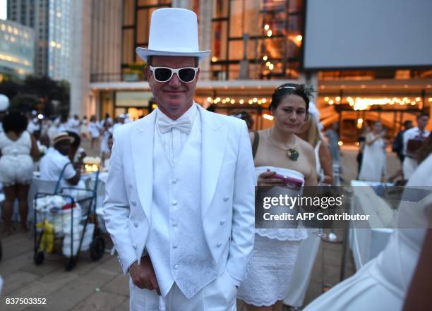 Guests attend the annual New York City Diner en Blanc, August 22, 2017 held this year at the plaza at Lincoln Center. The Diner en Blanc, the worlds...