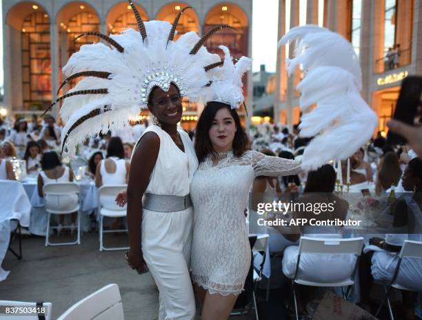 Guests attend the annual New York City Diner en Blanc, August 22, 2017 held this year at the plaza at Lincoln Center. The Diner en Blanc, the worlds...