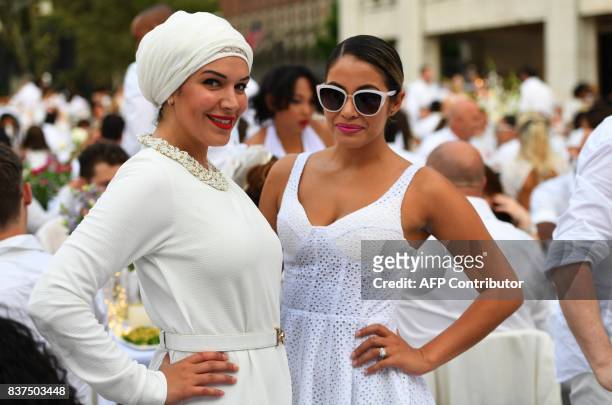 Guests attend the annual New York City Diner en Blanc, August 22, 2017 held this year at the plaza at Lincoln Center. The Diner en Blanc, the worlds...