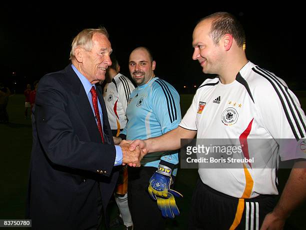 Germans football legend Bernd Trautmann shake hands with a player of the german national fan team in advance to the fan club rematch of wembley 2007...