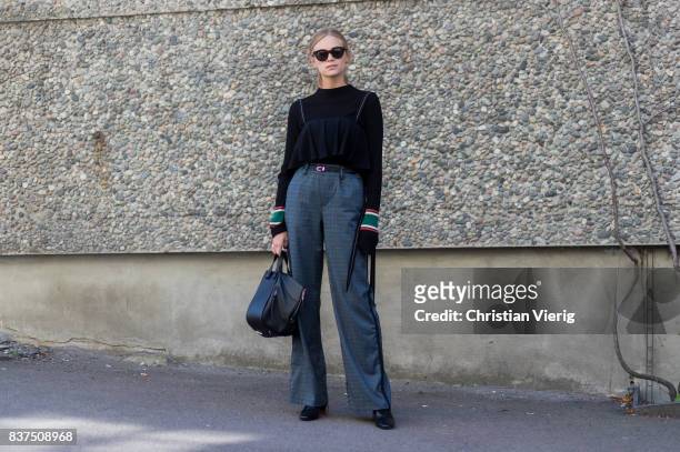 Tine Andrea wearing black Loewe bag outside IBEN on August 22, 2017 in Oslo, Norway.