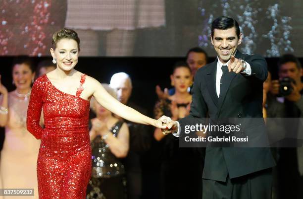 German Ballejo and Magdalena Gutierrez of Argentina celebrate after winning the final round of the Tango Salon competition as part of the Buenos...