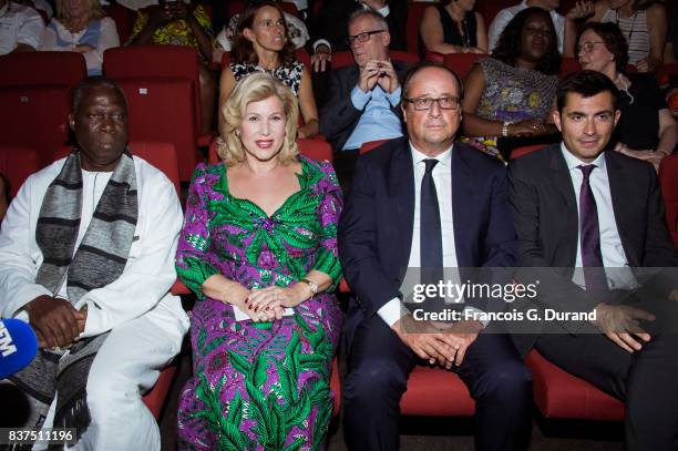 Ivorian Minister of Culture Maurice Kouakou Bandaman, Ivory Coast's wife Dominique Ouattara, former French president Francois Hollande and Moyor of...