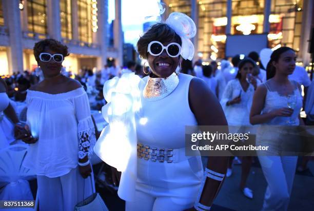 Guests attend the annual New York City Diner en Blanc, August 22, 2017 held this year at the plaza at Lincoln Center. The Diner en Blanc, the worlds...