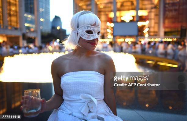 Guests attend the annual New York City Diner en Blanc, August 22, 2017 held this year at the plaza at Lincoln Center. The Diner en Blanc, the worlds...