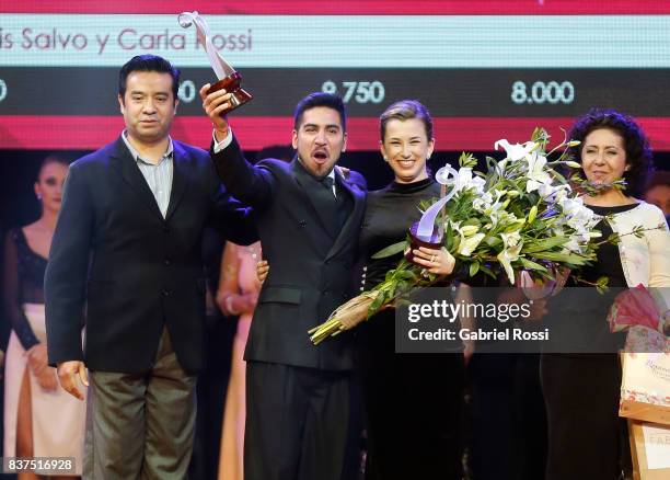 Jose Luis Salvo and Carla Rossi of Argentina celebrate after winning the second place during the final round of the Tango Salon competition as part...