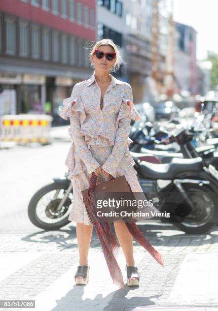 Janka Polliani wearing a dress, brown Mulberry bag outside Moods of Norway on August 22, 2017 in Oslo, Norway.