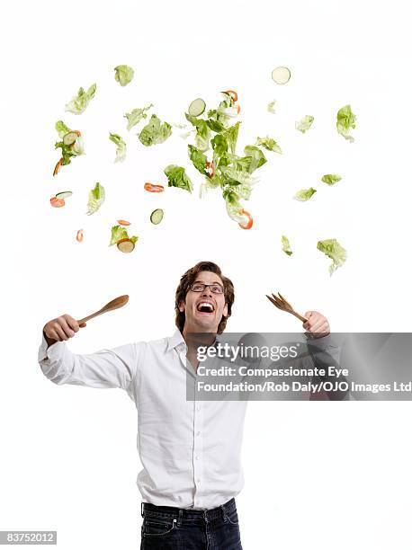 man throwing salad - salad server stock pictures, royalty-free photos & images