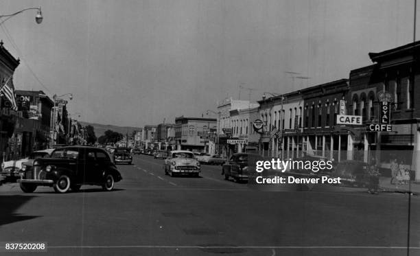 Here is the main traffic artery of beautiful Canon City, county seat of Fremont county, home of the Colorado state penitentiary and tourist center...