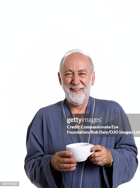 man in dressing gown with coffee - 8897 stock pictures, royalty-free photos & images