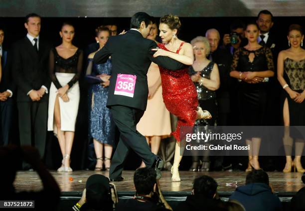 German Ballejo and Magdalena Gutierrez of Argentina dance during the final round of the Tango Salon competition as part of the Buenos Aires...