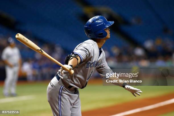 Norichika Aoki of the Toronto Blue Jays hits a home run off of pitcher Chris Archer of the Tampa Bay Rays during the first inning of a game on August...