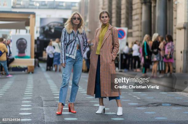 Emili Sindlev wearing jacket with collar, cropped denim jeans and Darja Barannik wearing a plaid coat, yellow button shirt, white boots, cropped...