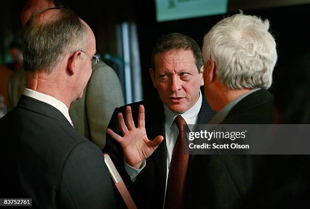 Thomas Pritzker, Chairman of Global Hyatt Corporation , speaks with guests following a panel discussion on the global financial crisis hosted by The...