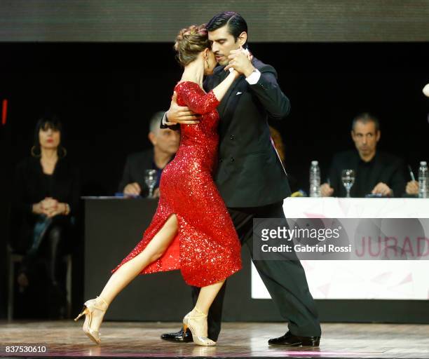 German Ballejo and Magdalena Gutierrez of Argentina dance during the final round of the Tango Salon competition as part of the Buenos Aires...