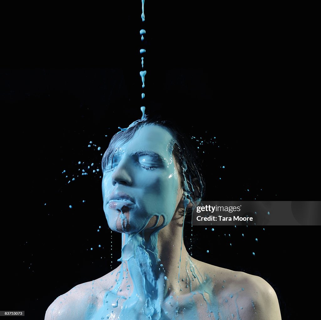 Man covered in blue paint