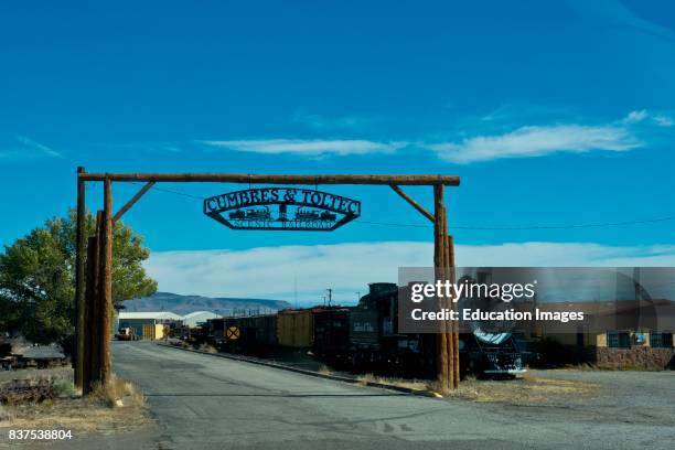 North America, USA, Colorado, Antinito, Cumbres & Toltec Narrow Gauge Railroad Facilities, Rail yard Entrance Sign and Arch and Locomotive and...