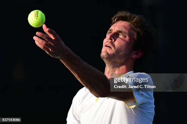 Gilles Simon of France serves to Damir Dzumhur of Bosnia during the fourth day of the Winston-Salem Open at Wake Forest University on August 22, 2017...