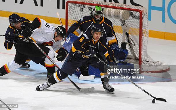 Mikael Kurki of Espoo Blues runs with the puck during the IIHF Champions Hockey League match between Espoo Blues and SC Bern on November 19, 2008 in...