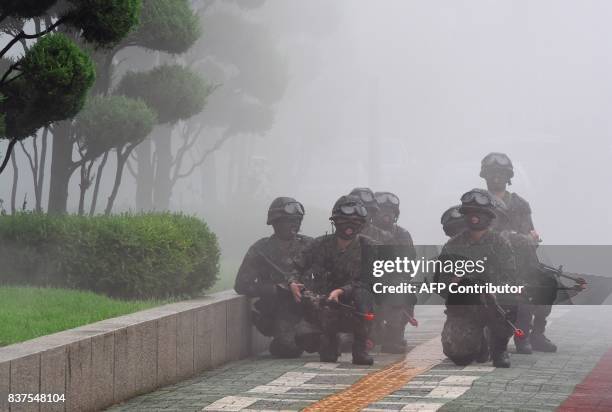 South Korean soldiers participate in an anti-terror drill at the National Assembly in Seoul on August 23 on the sidelines of a South Korea-US joint...