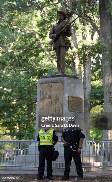 Confederate statue, coined Silent Sam, is guarded by two layers of fence, chain and police on the campus of the University of Chapel Hill on August...