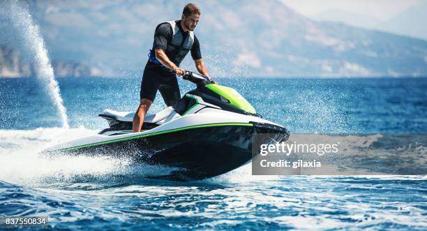 jet skiing. - jet ski stock pictures, royalty-free photos & images